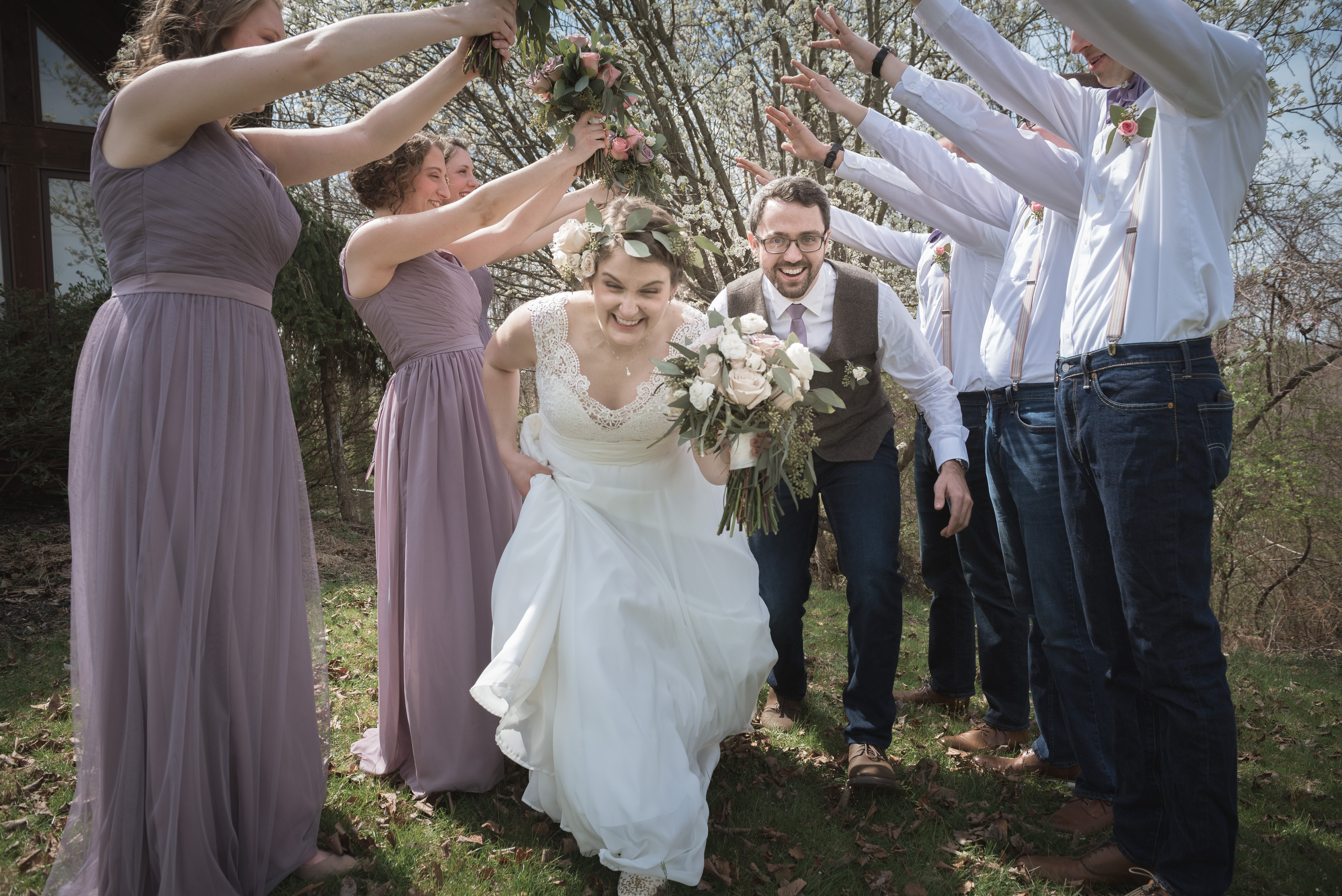 creative bride and groom portrait photography with wedding party in the spring in Athens Ohio