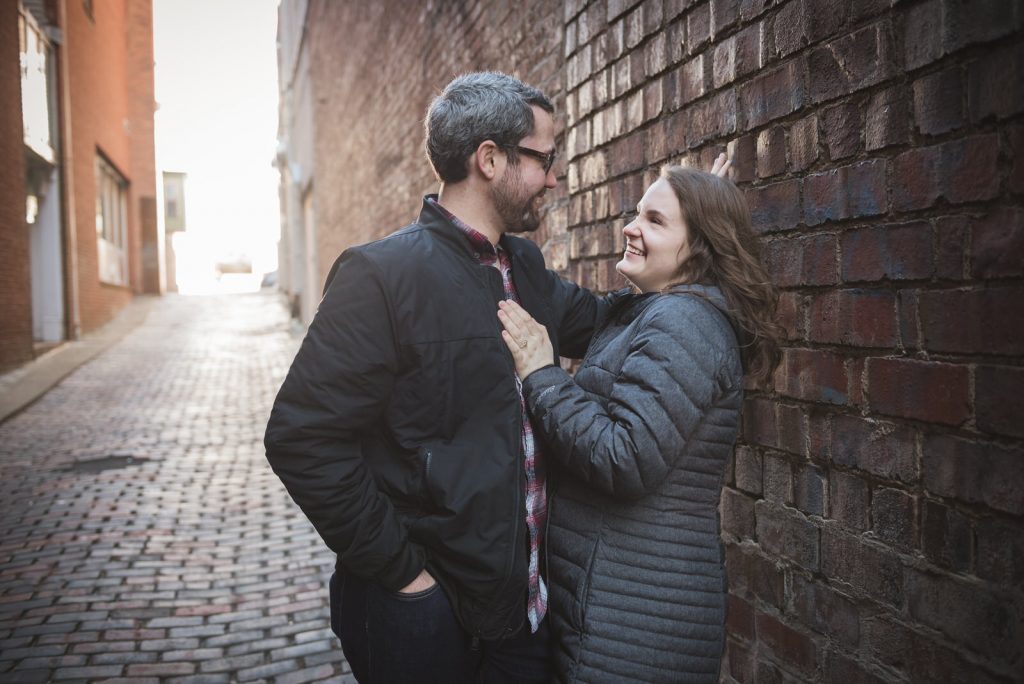 engagement session on court street in Athens Ohio in the winter