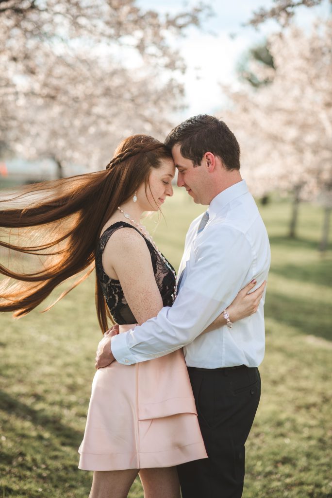 wind blown hair during engagement photography session in Athens Ohio