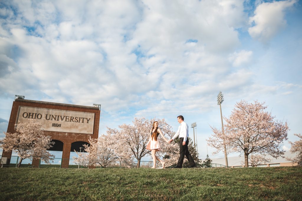 walking during engagement session at Ohio University with the best photographer