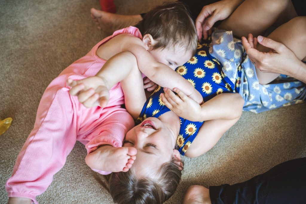 little girls playing together at family documentary film video session