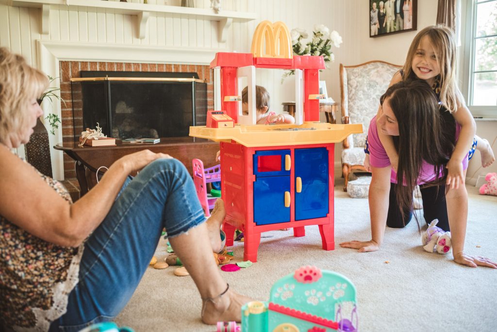 mother, daughter and grandma playing at documentary photography session