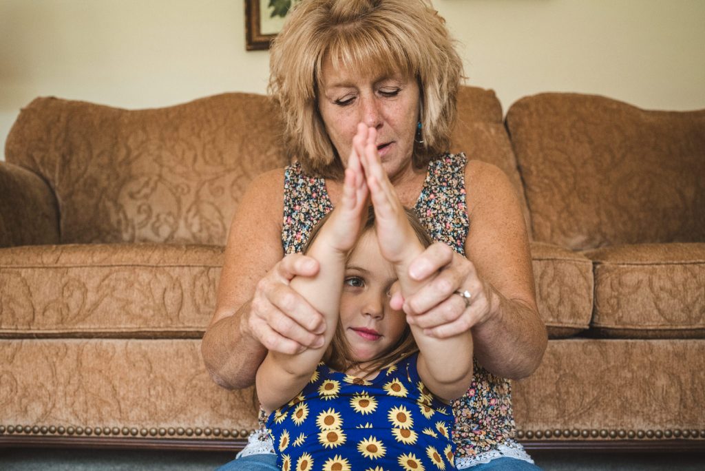 grandma and granddaughter playing at family photography session in Athens Ohio