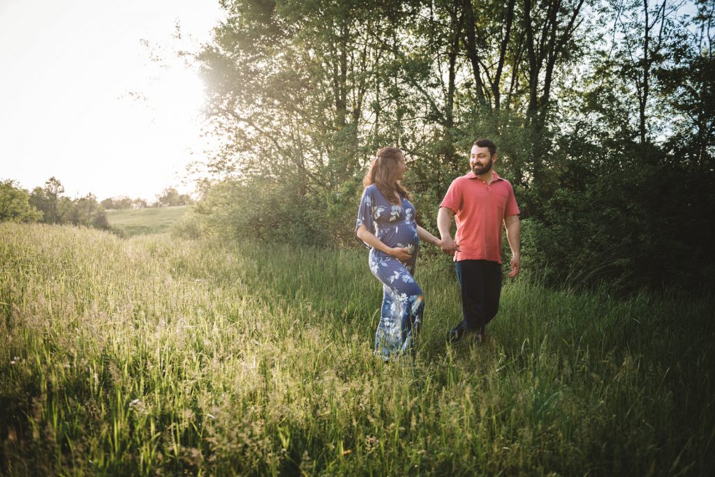 walk-in-field-at-maternity-photo-session