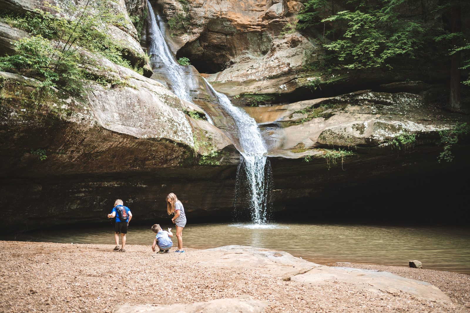 kids in front of Cedar Falls waterfall in Hocking Hills