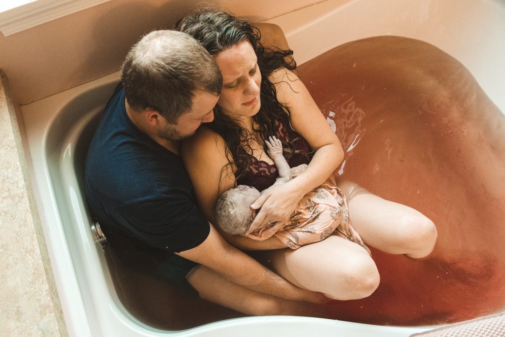 home birth in bathtub with husband