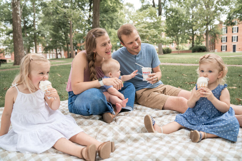 family eating ice cream on college green at ohio university uptown athens